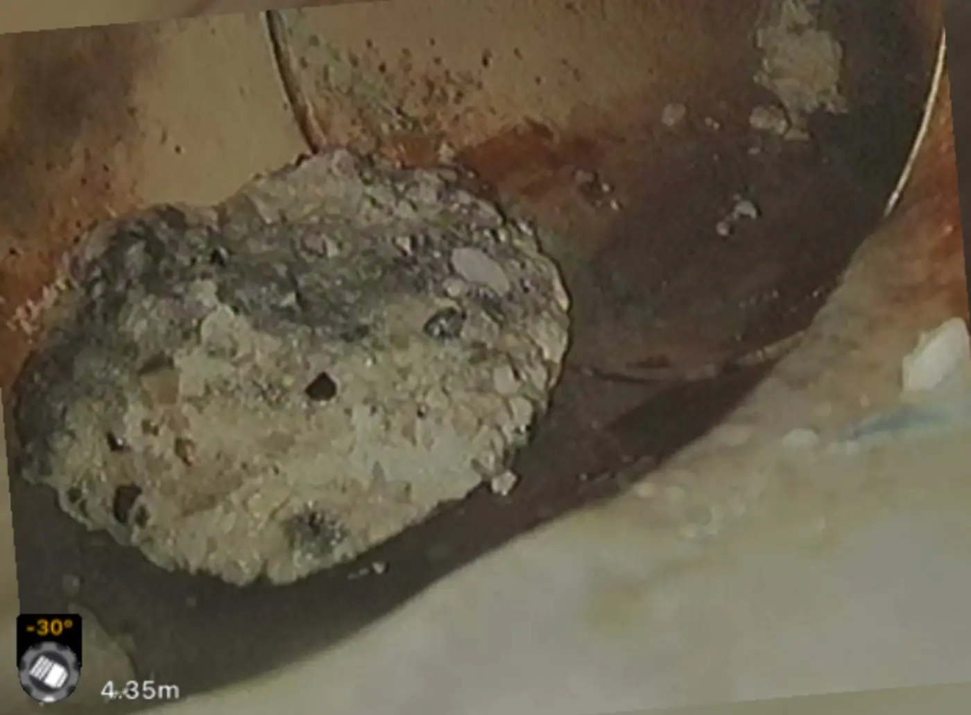 CCTV frame of a pipe blocked solid with debris