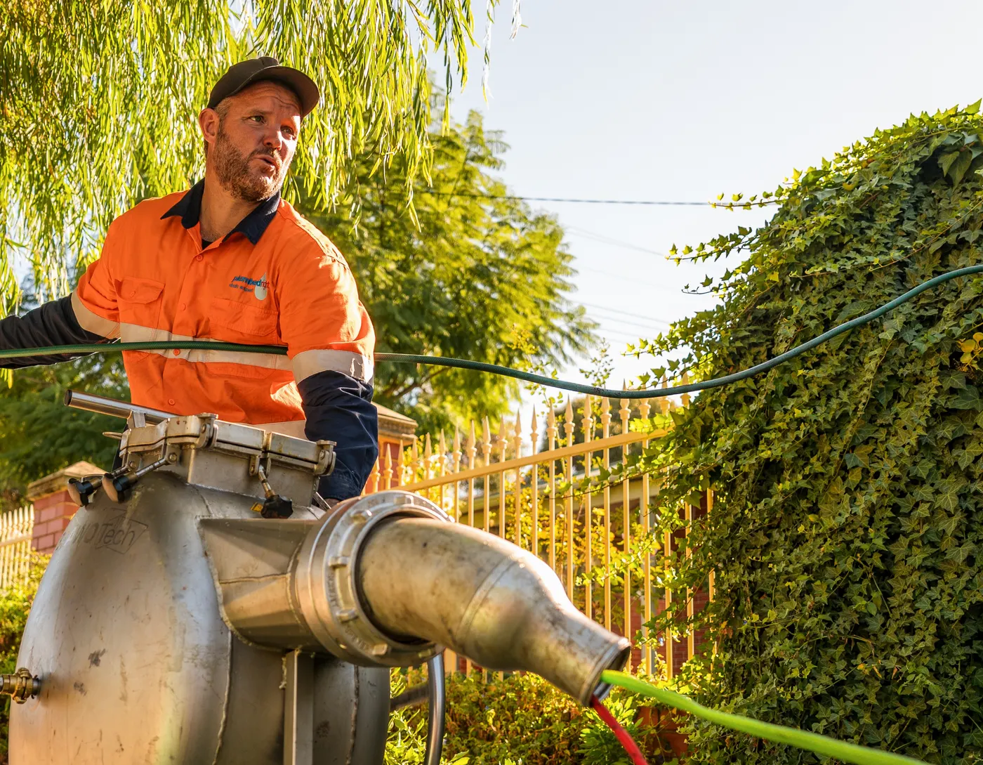 Michael Treble working the pipe relining inversion drum on a Perth verge