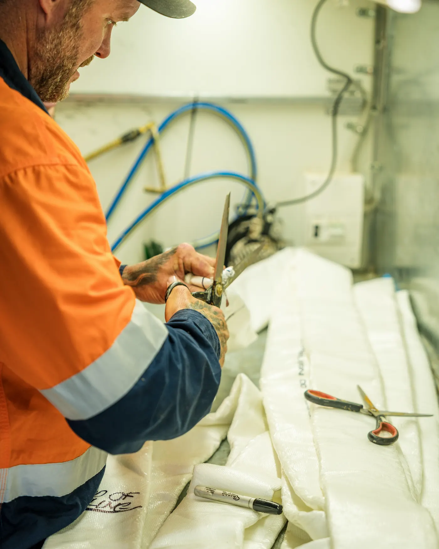 Michael cutting a relining liner in the van