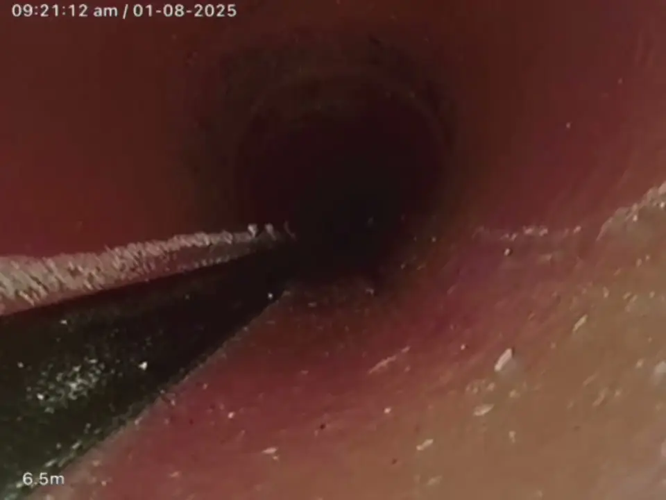 CCTV view down a pipe lined with a smooth new resin liner